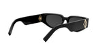 A pair of black sunglasses with a gold-colored frame and a diamond-shaped logo on the side.