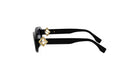 A pair of black sunglasses with gold accents, featuring a distinctive logo on the temples.