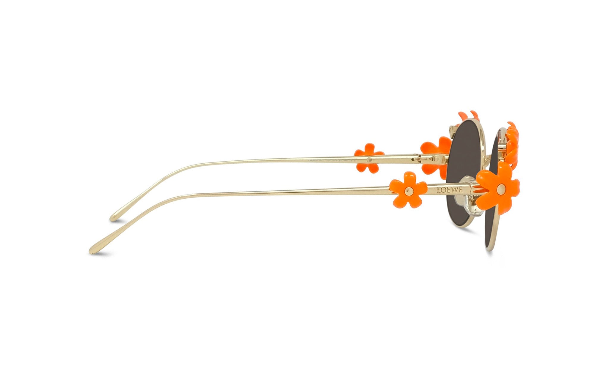 A pair of stylish sunglasses with orange flower embellishments on the temples and arms.