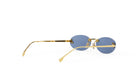 A pair of gold-framed sunglasses with blue lenses is shown against a white background.