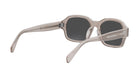 A pair of stylish sunglasses with a clear frame and dark lenses.