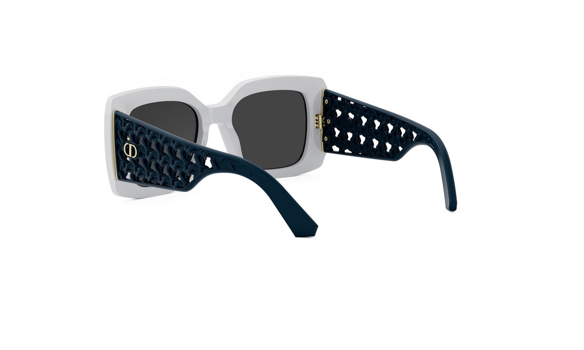 A pair of stylish sunglasses with a white frame and black perforated pattern on the sides.