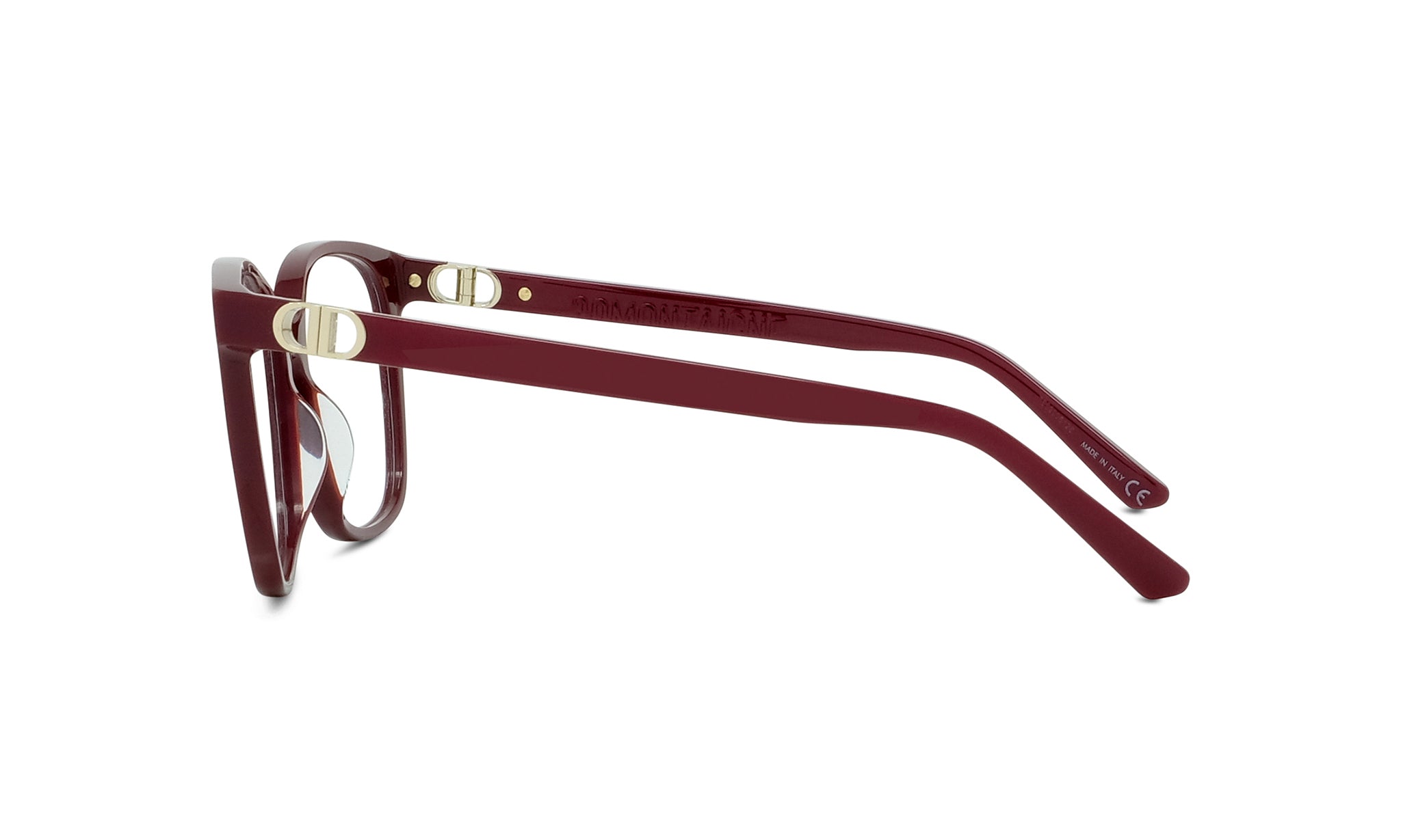 A pair of burgundy-colored eyeglasses with gold-colored metal accents.
