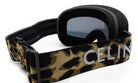 A pair of black ski goggles with a camouflage pattern and the word "CELIN" printed on the strap.