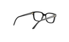 A pair of black-framed glasses with gold accents, positioned facing away from the camera.