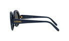 A pair of dark blue sunglasses with gold text on the frame.