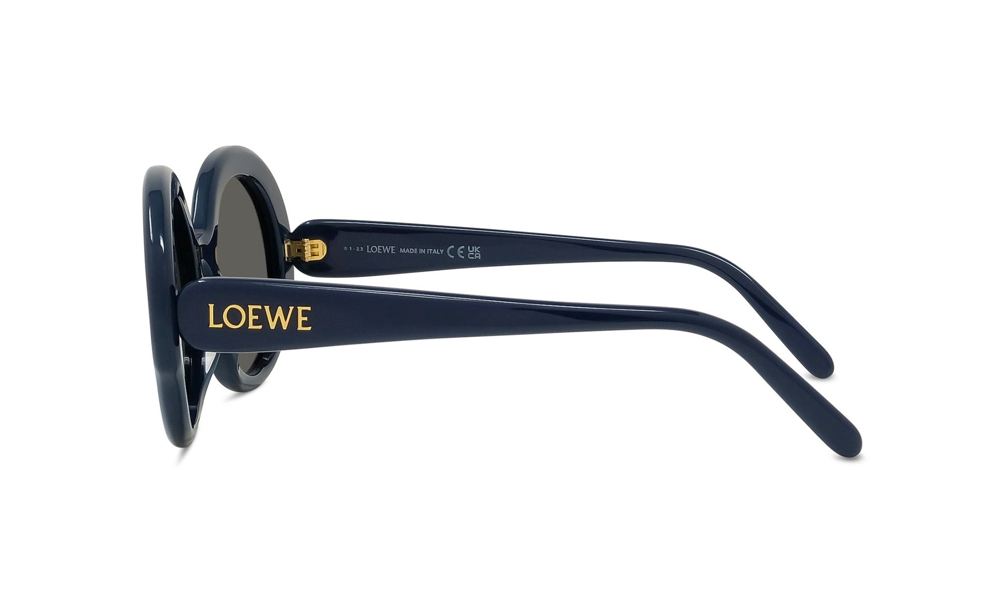 A pair of dark blue sunglasses with gold text on the frame.