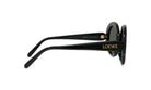 A pair of black sunglasses with gold text on the frame.