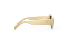 A pair of tan-colored sunglasses with a logo on the side.