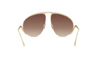 A pair of gold-colored sunglasses with a unique, avant-garde design.
