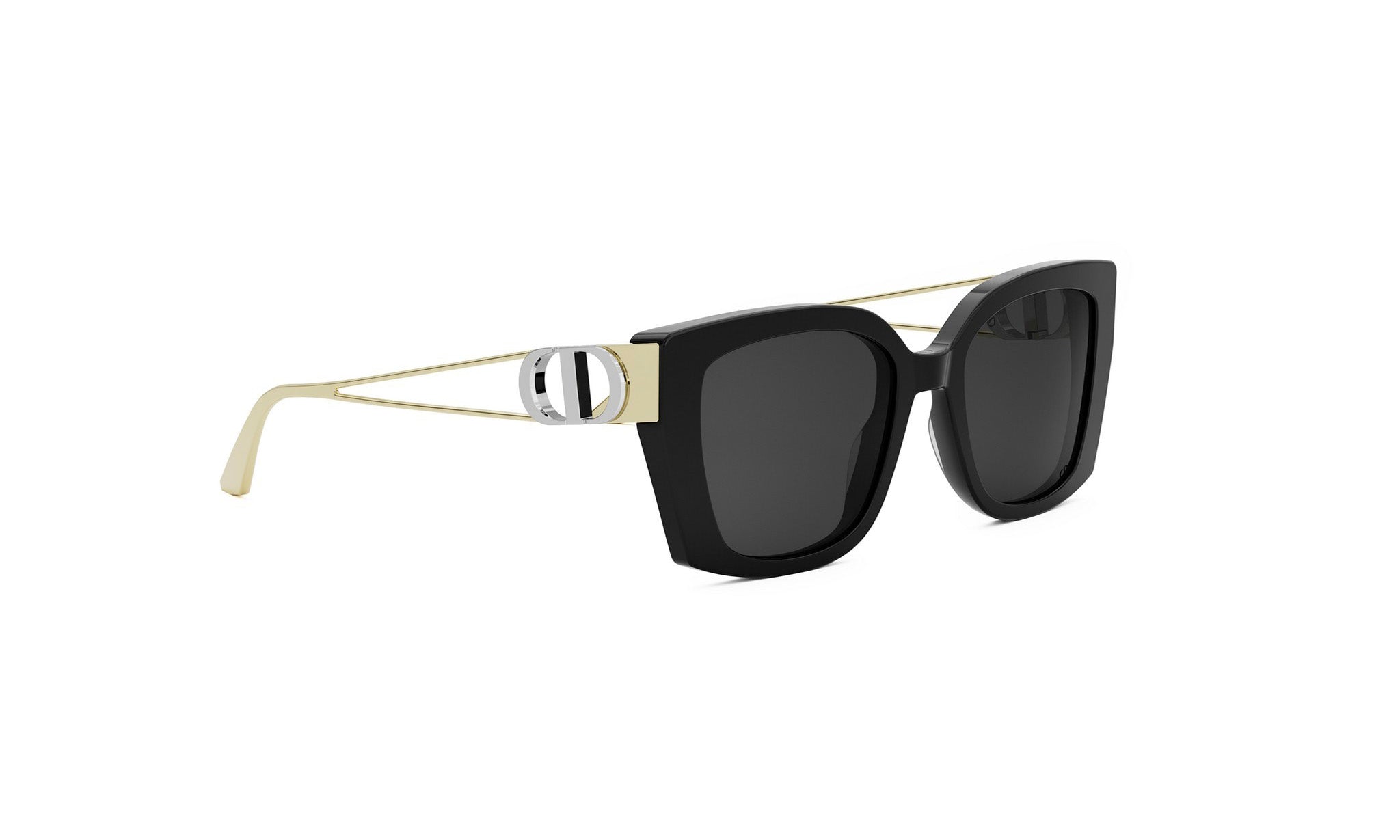 A pair of black sunglasses with a gold frame and a silver D-shaped accent.