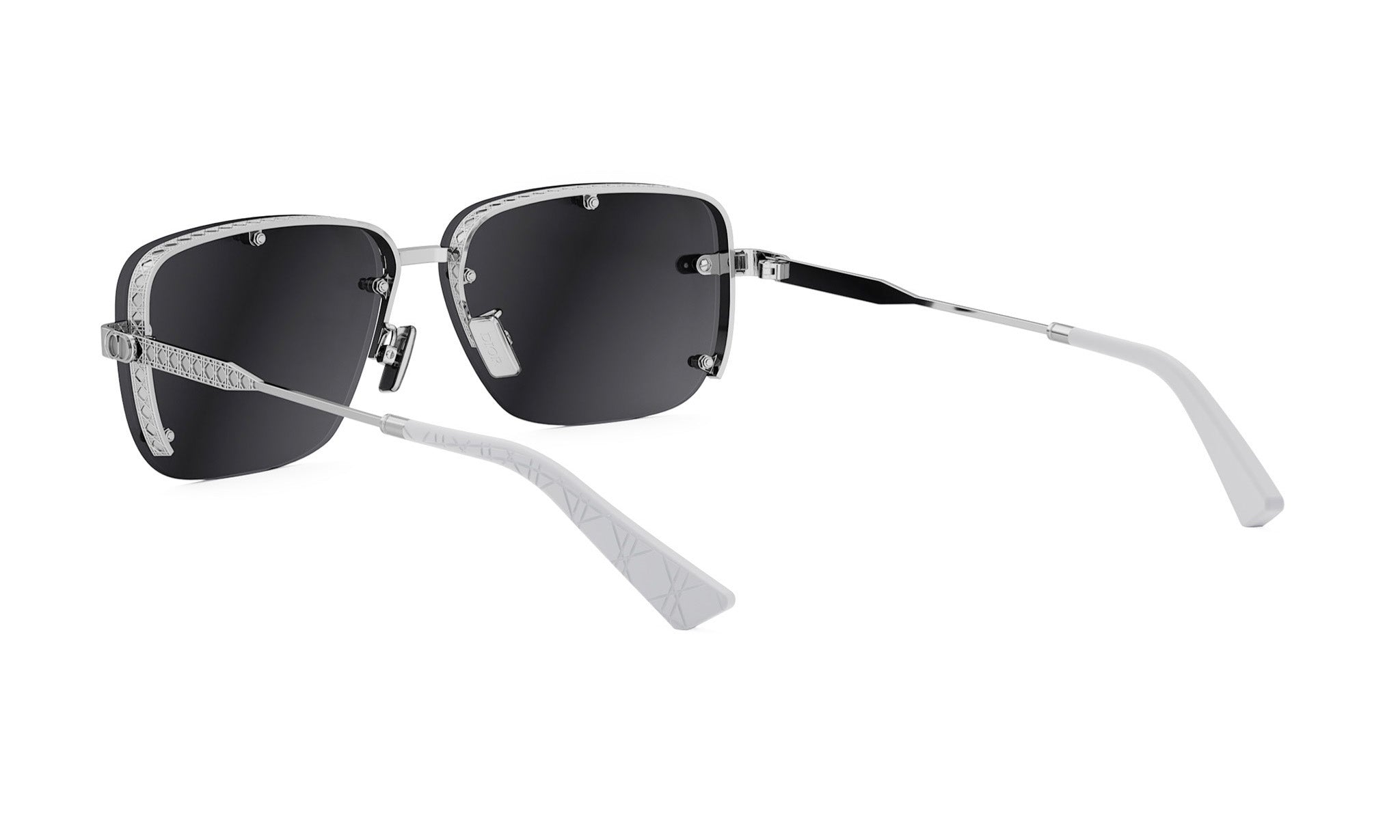 A pair of black-framed sunglasses with white accents, positioned on a white background.