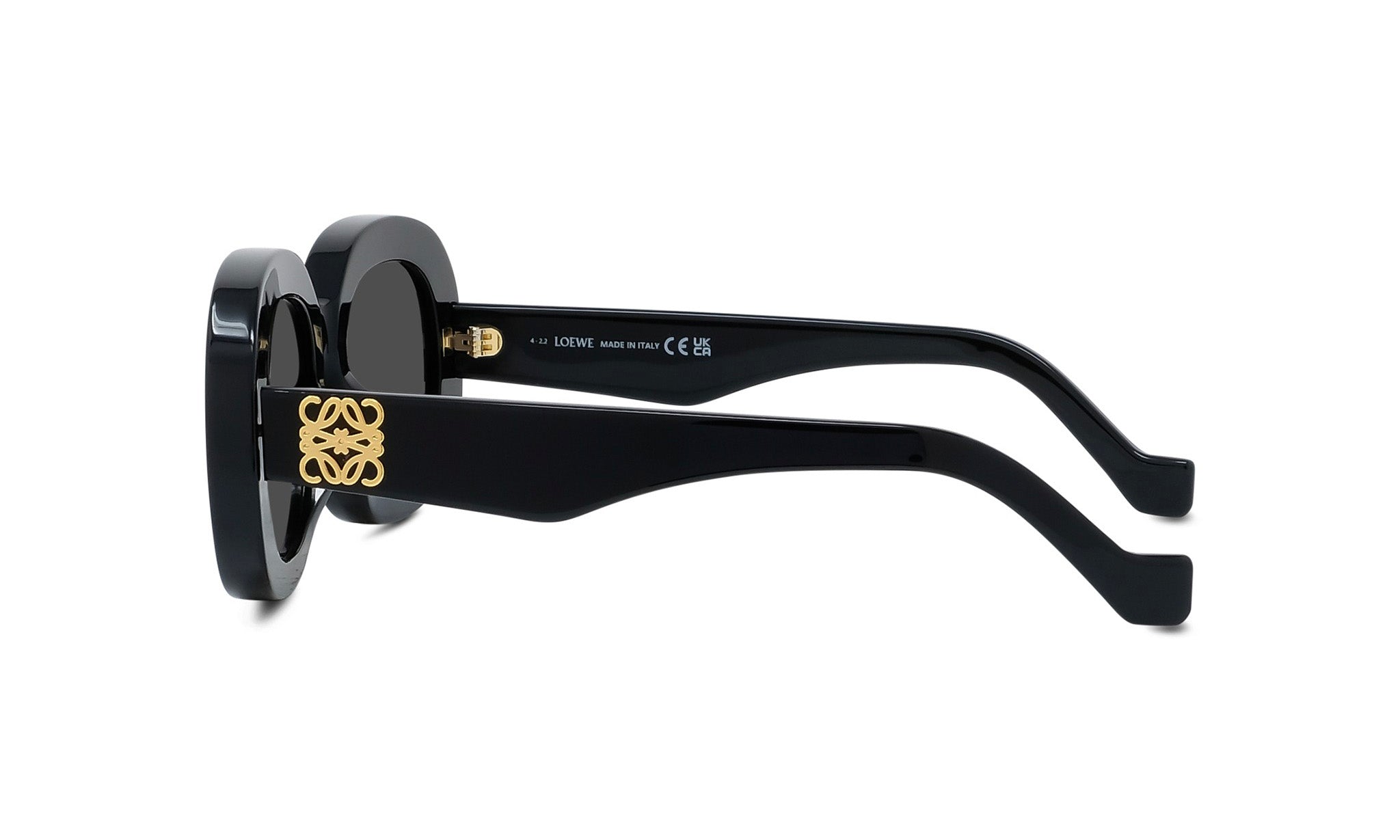 A pair of black sunglasses with gold accents, featuring a round frame and dark lenses.