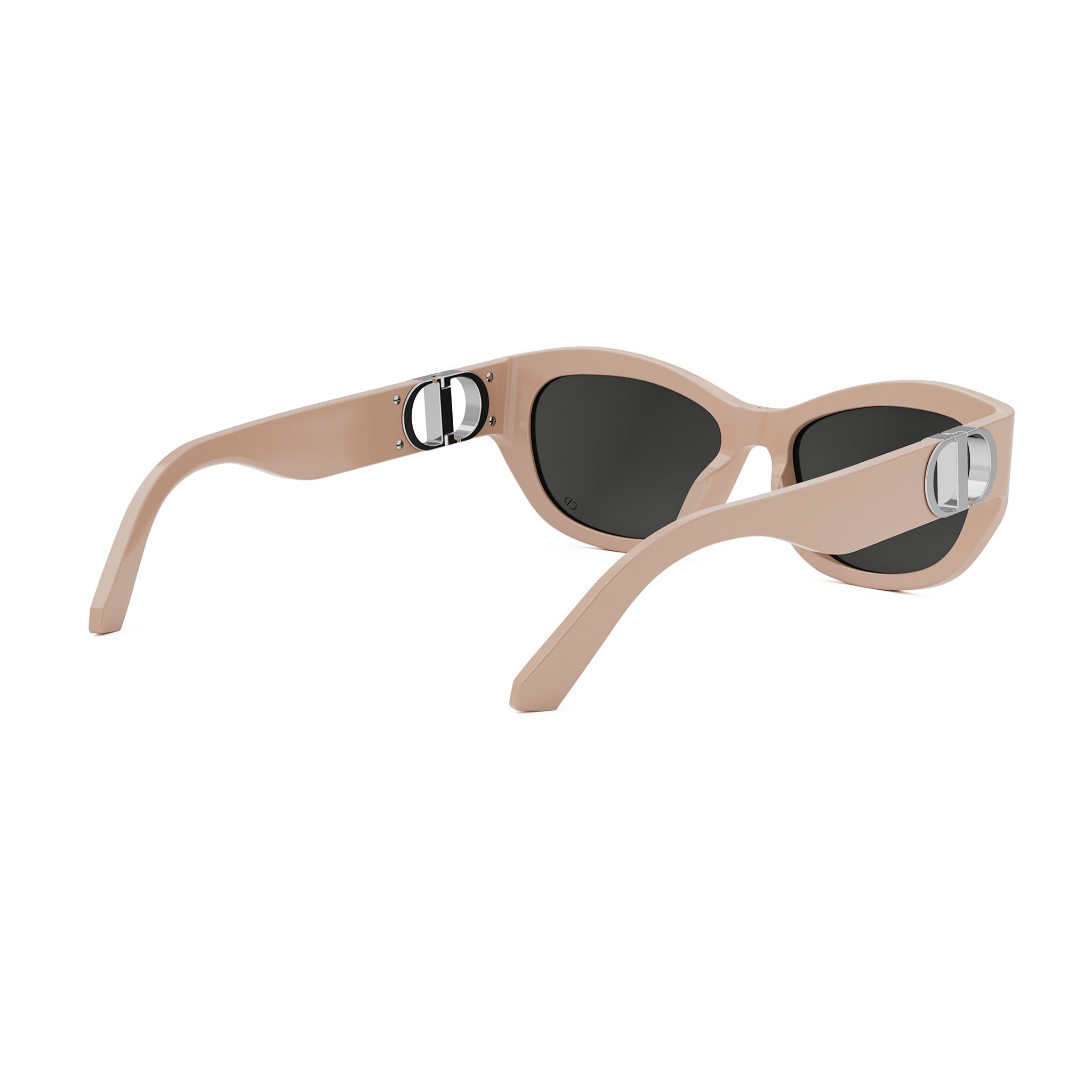A pair of tan-colored sunglasses with black lenses, featuring a silver Dior logo on the temples.