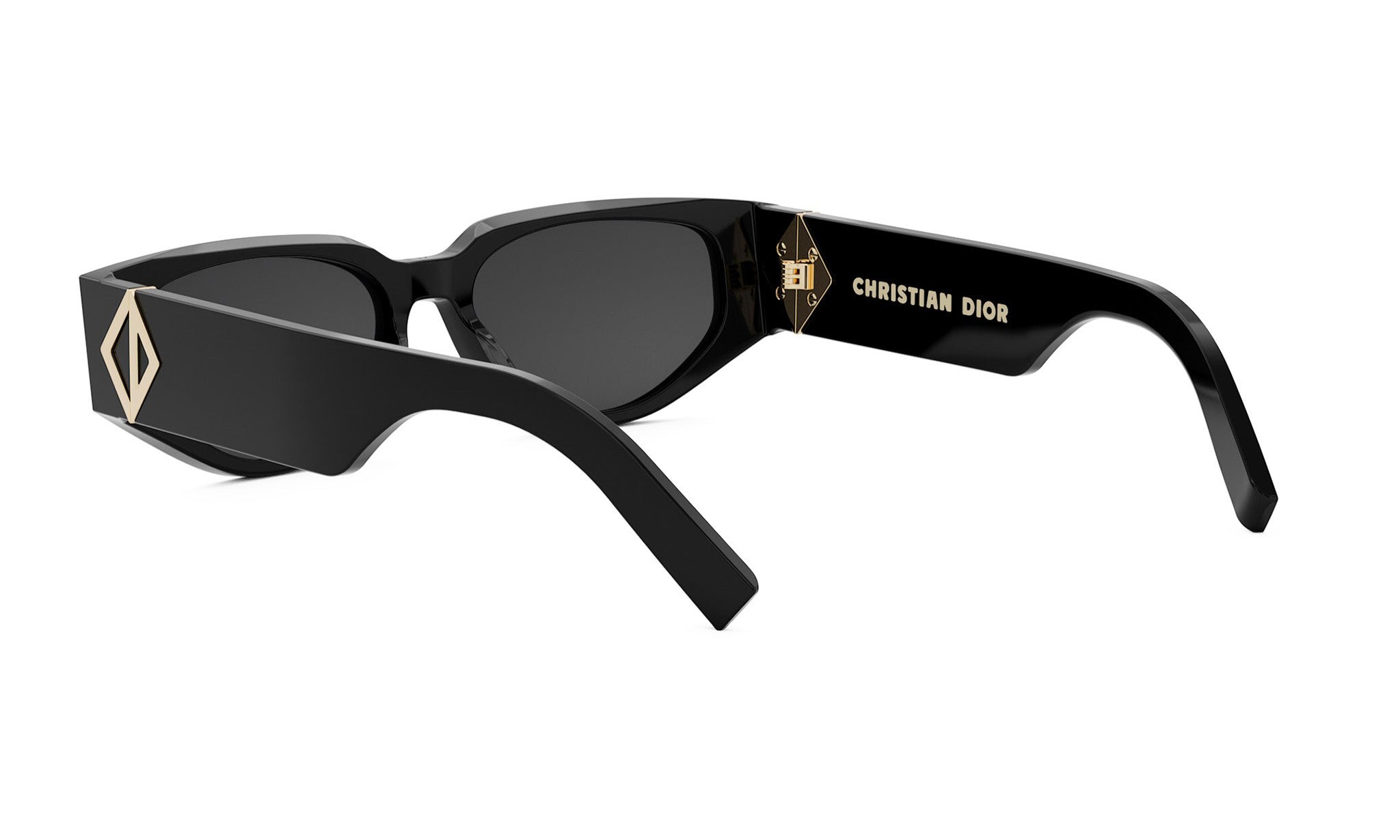 A pair of black sunglasses with a gold logo on the frame.