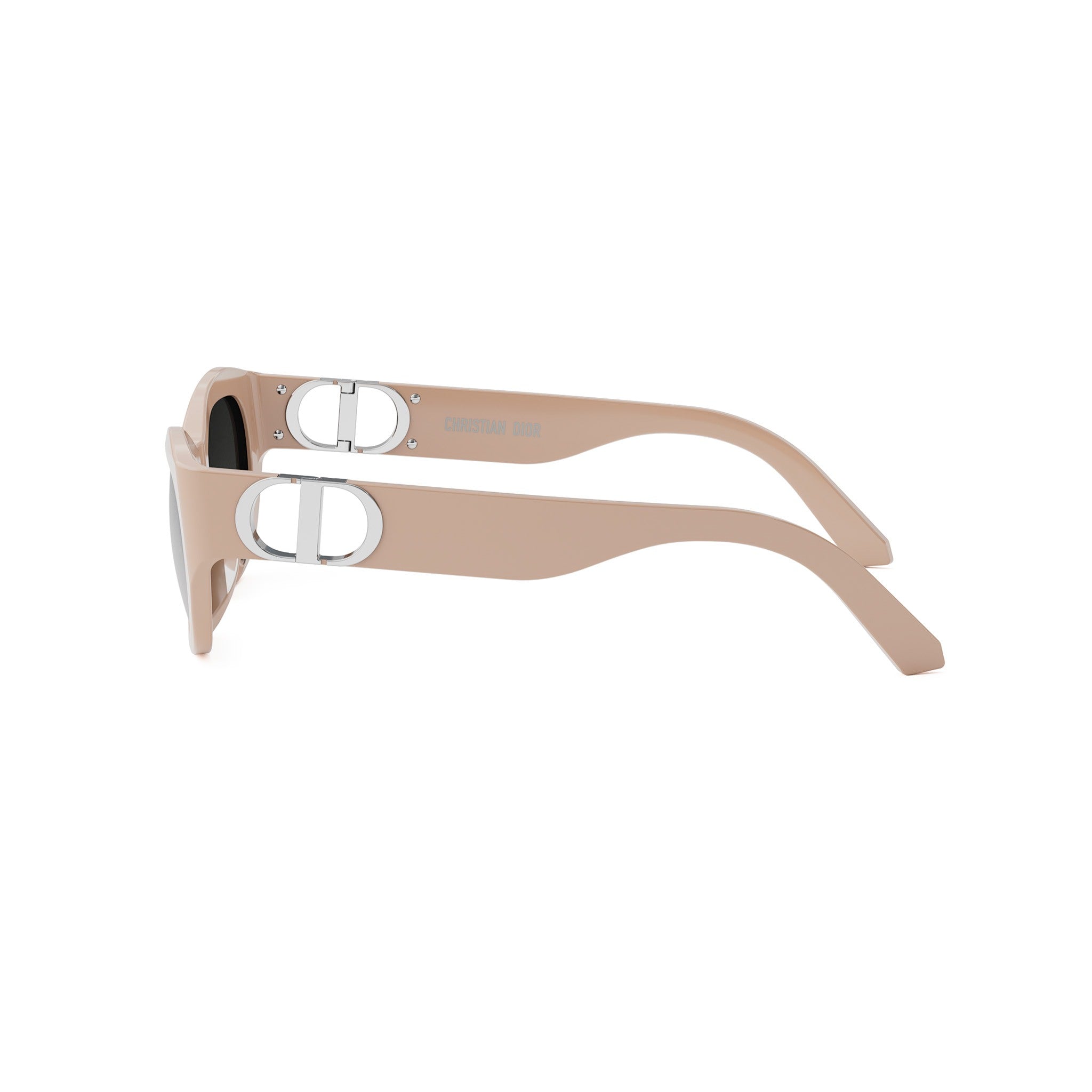 A pair of tan-colored sunglasses with a silver Dior logo on the frame.