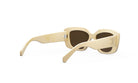 A pair of beige-colored sunglasses with dark lenses, featuring a logo on the frame.