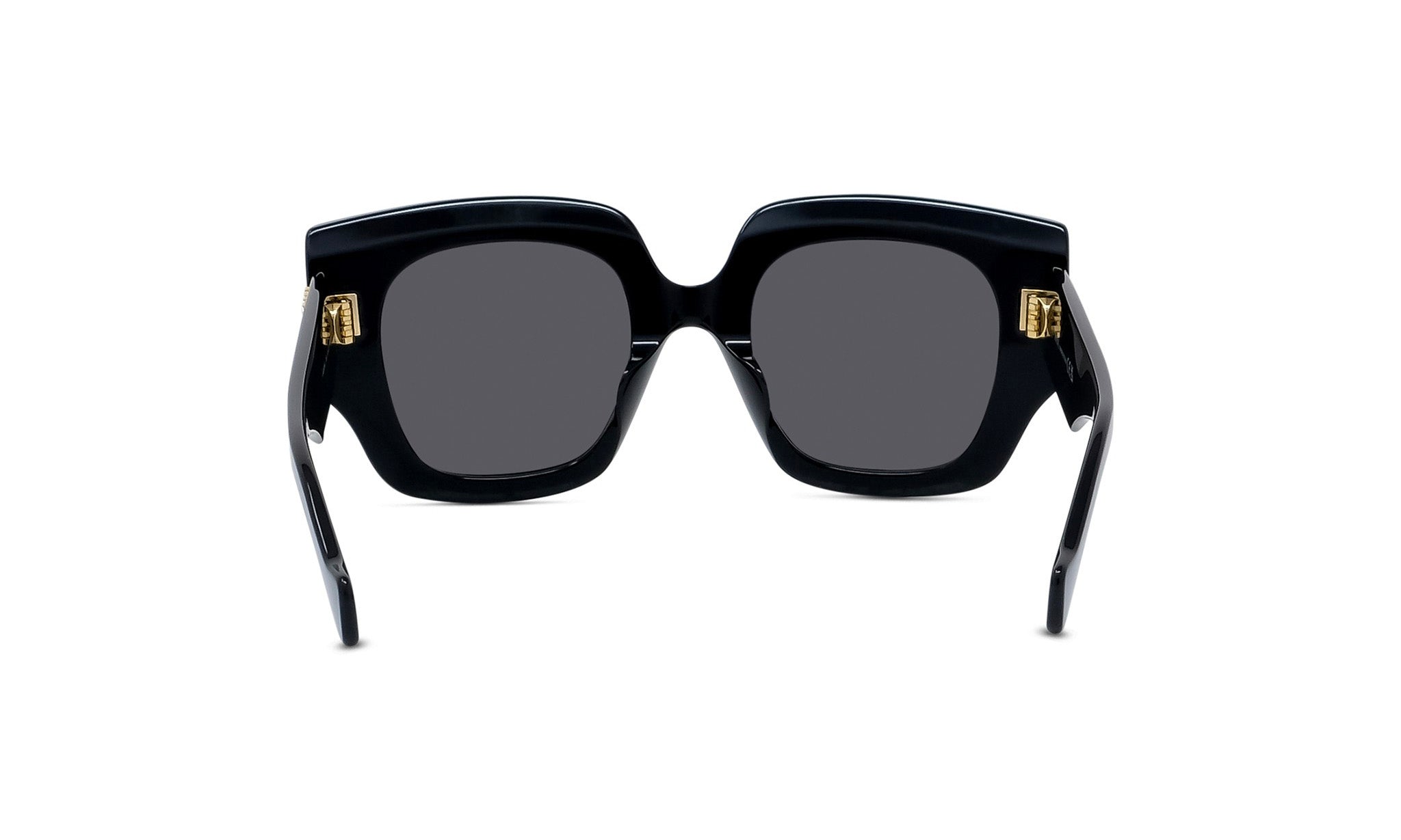 A pair of black sunglasses with gold accents, featuring a sleek and stylish design.
