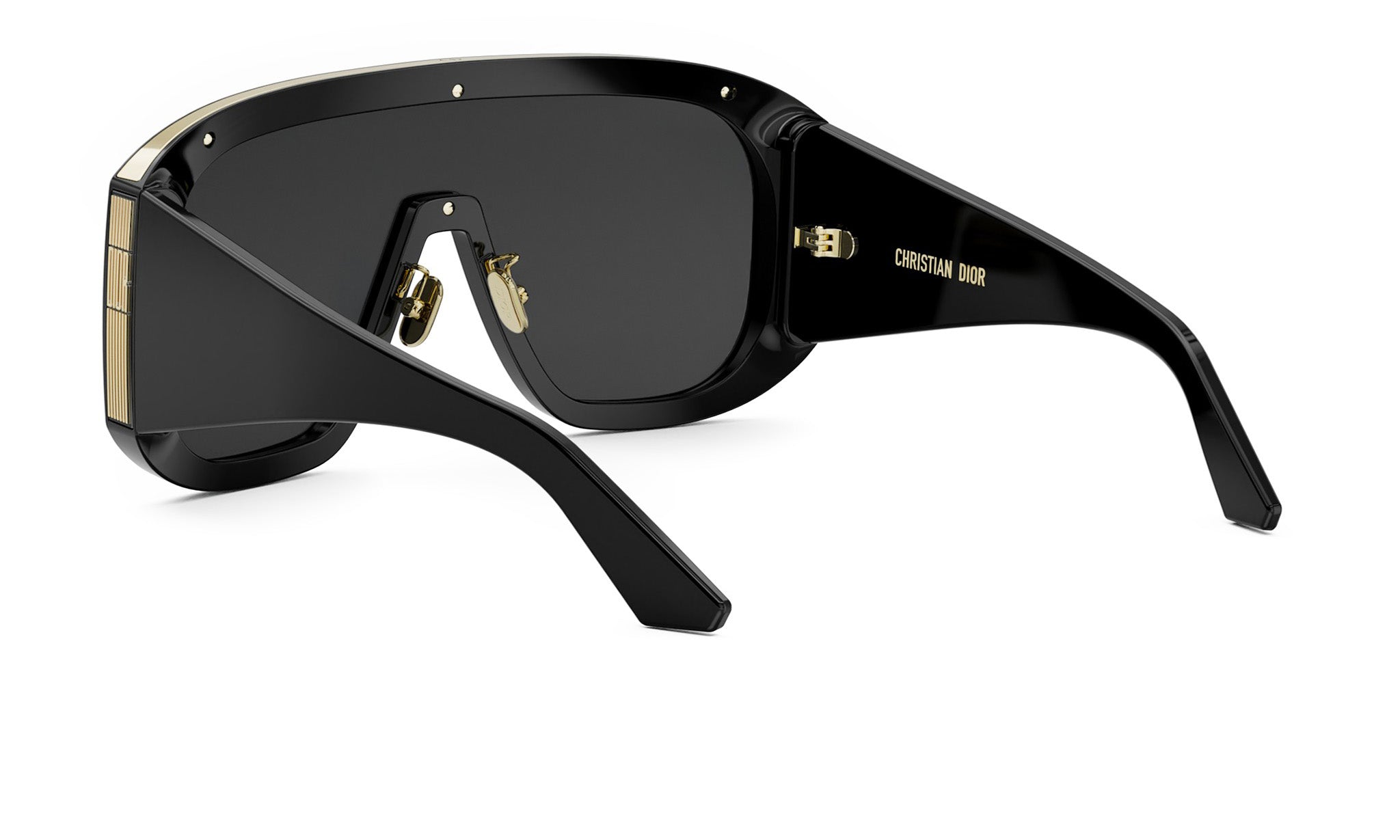 A pair of black sunglasses with gold accents, featuring the Dior logo on the frame.
