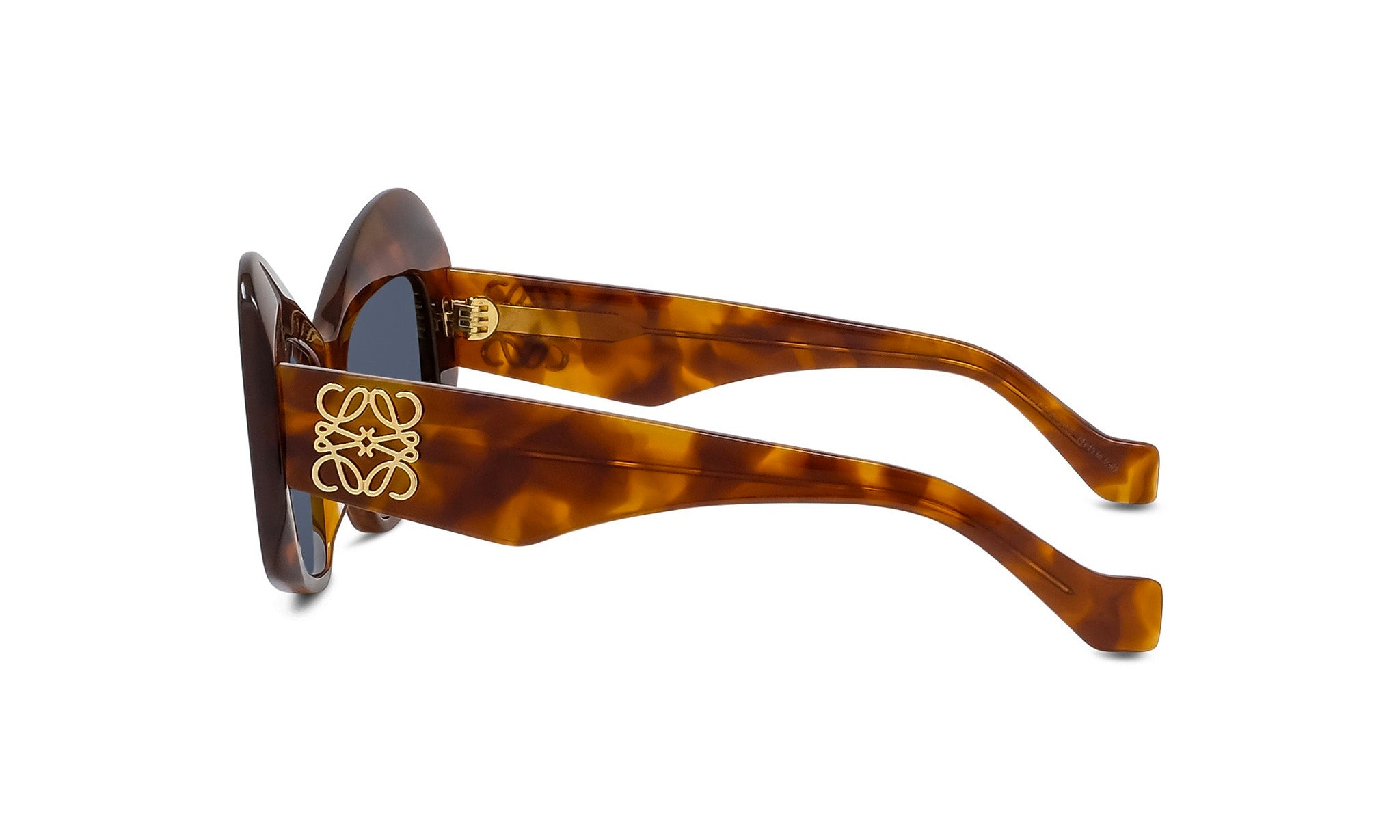 A pair of brown sunglasses with a gold logo on the frame.