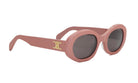 A pair of pink sunglasses with a gold logo on the frame.