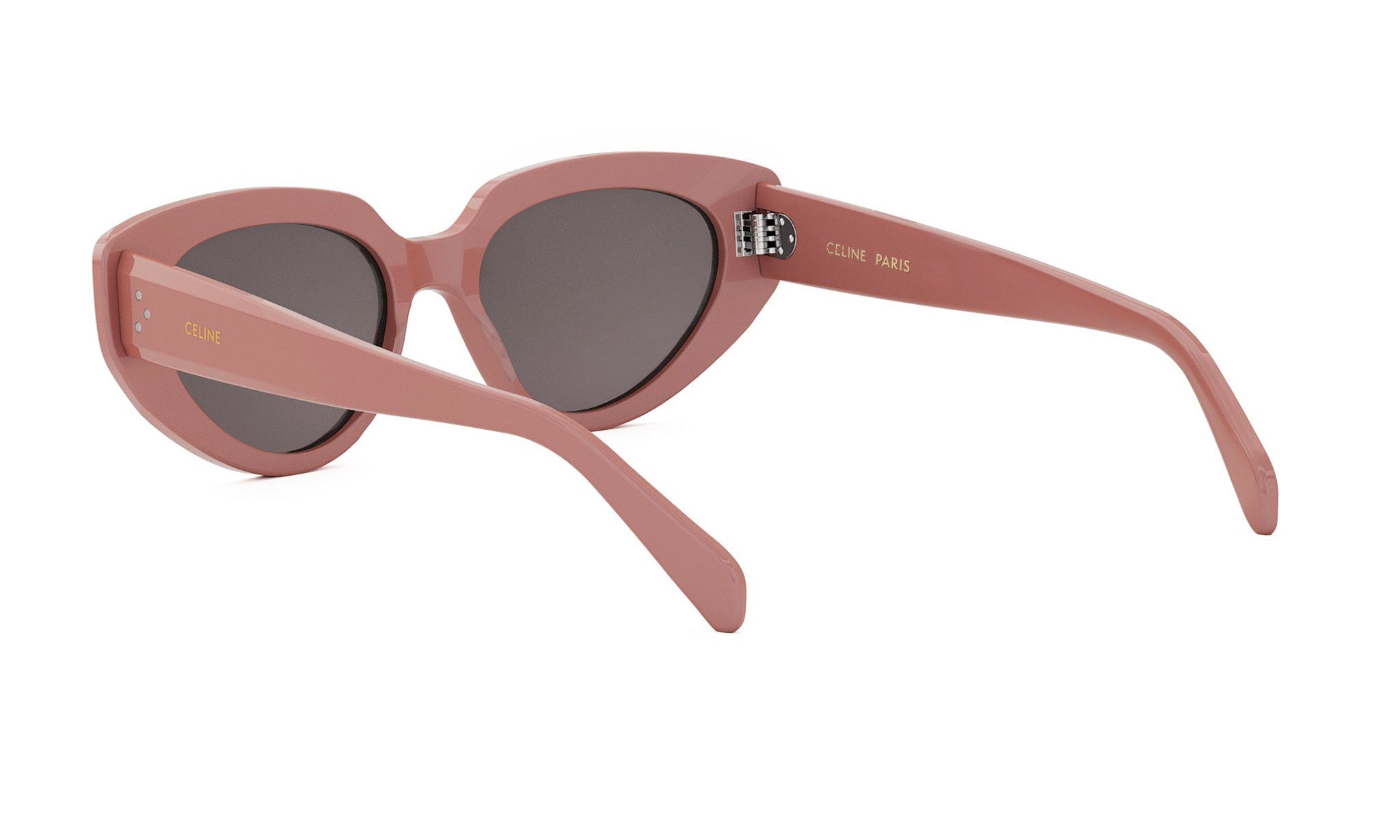 A pair of pink cat-eye sunglasses with the Celine Paris logo on the frame.