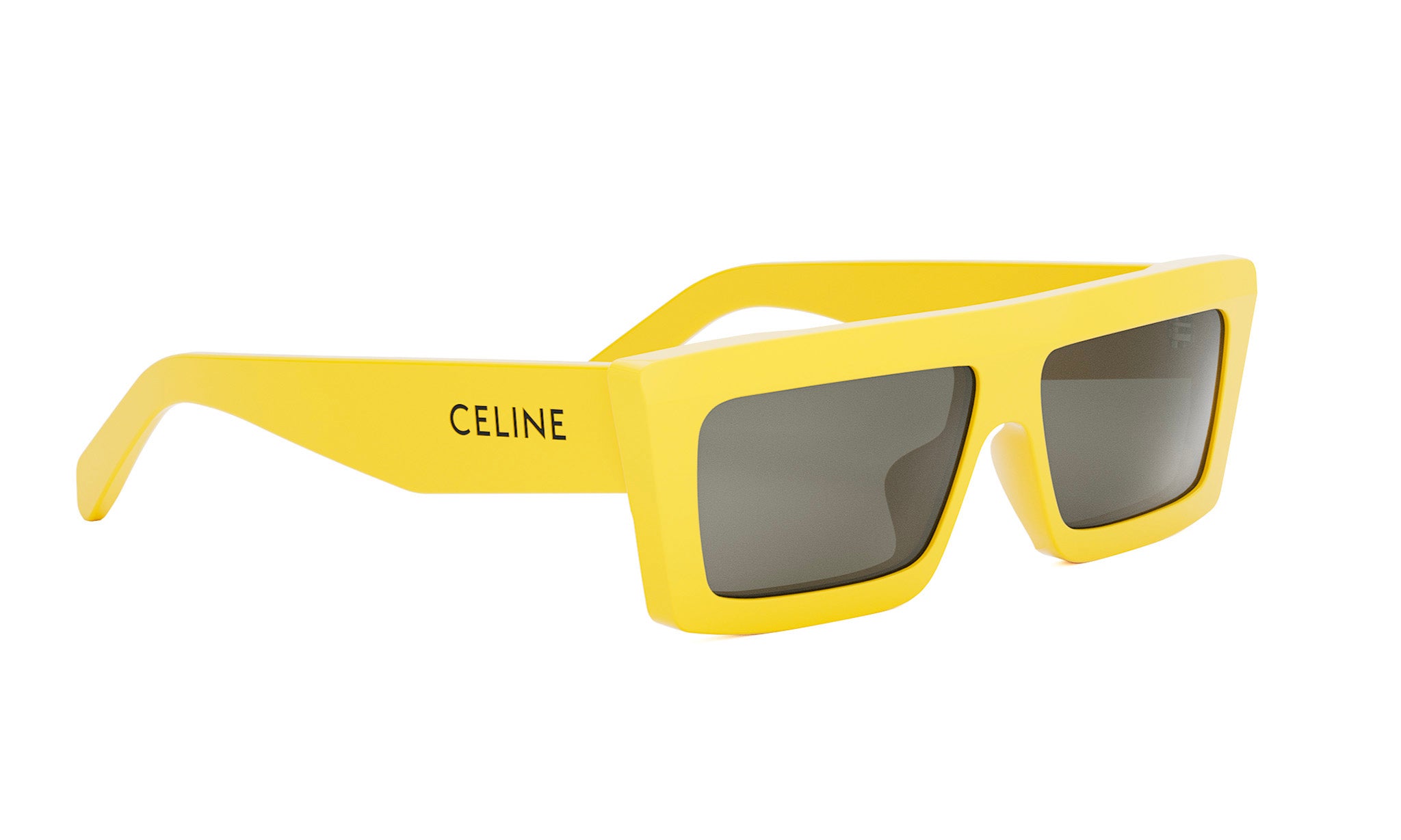 A pair of yellow sunglasses with the Celine logo on the frame.