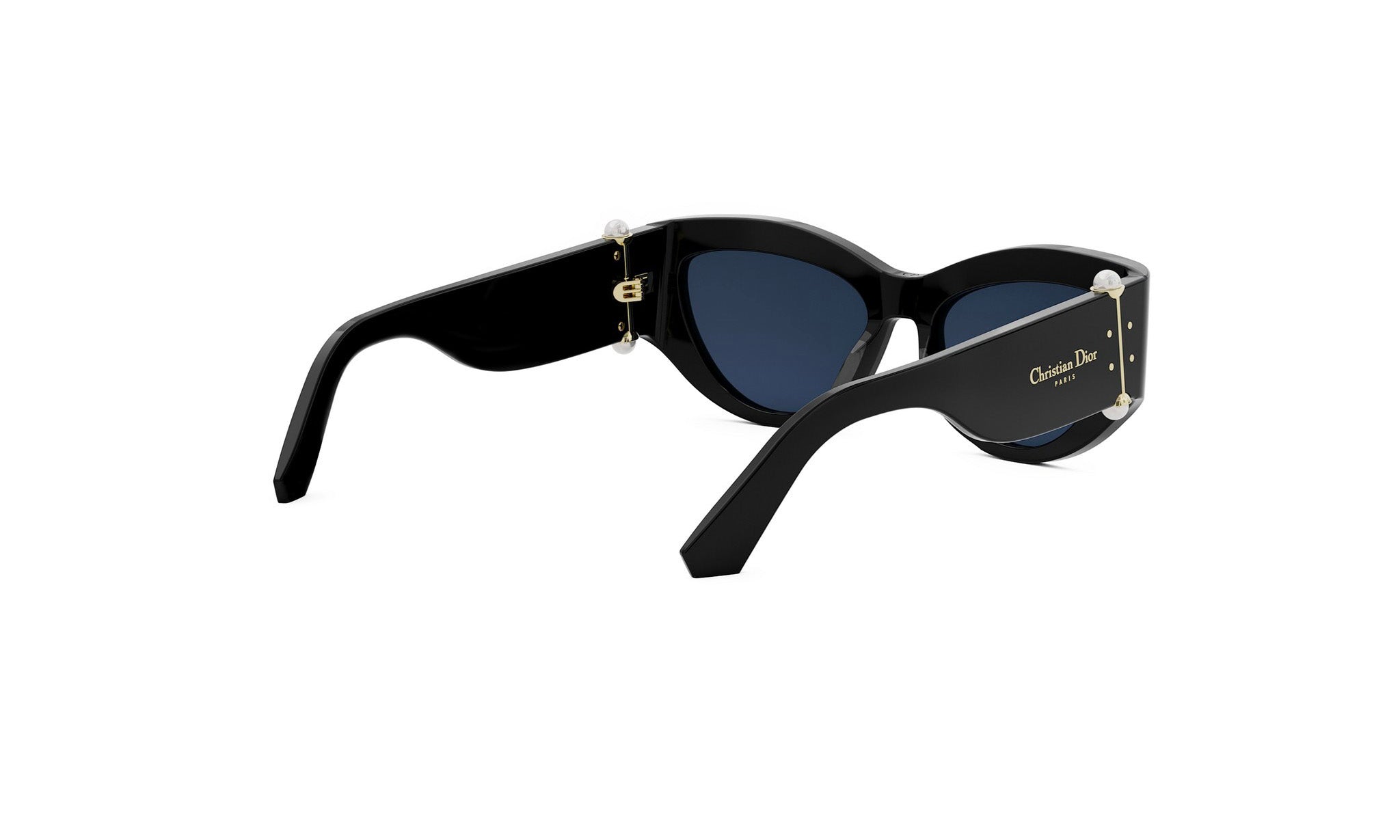 A pair of black cat-eye sunglasses with gold accents, featuring the Dior logo on the frame.