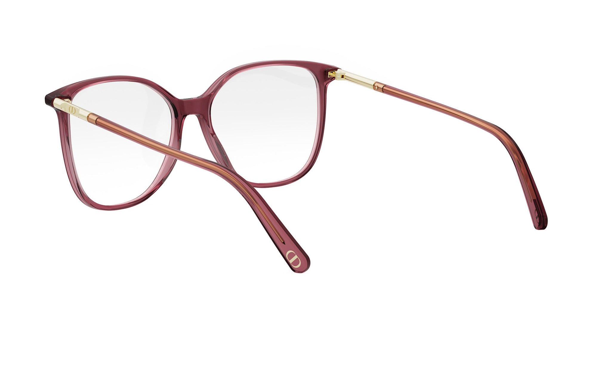 A pair of red-tinted glasses with gold-colored metal accents, resting on a white background.