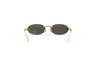 A pair of gold rimmed sunglasses with dark lenses, displayed against a white background.