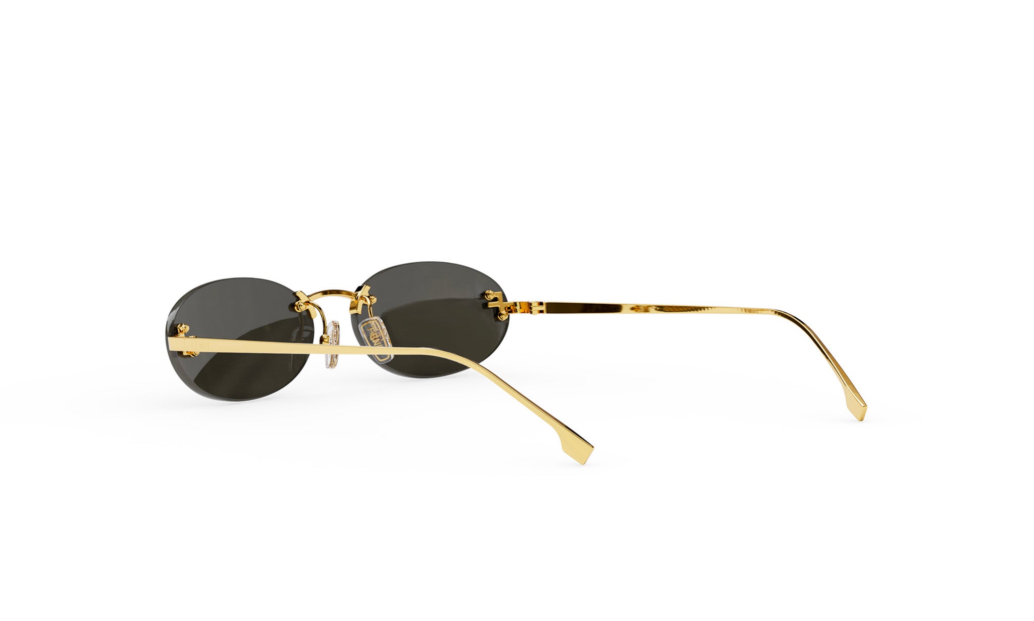 A pair of gold rimmed sunglasses with dark lenses is shown against a white background.