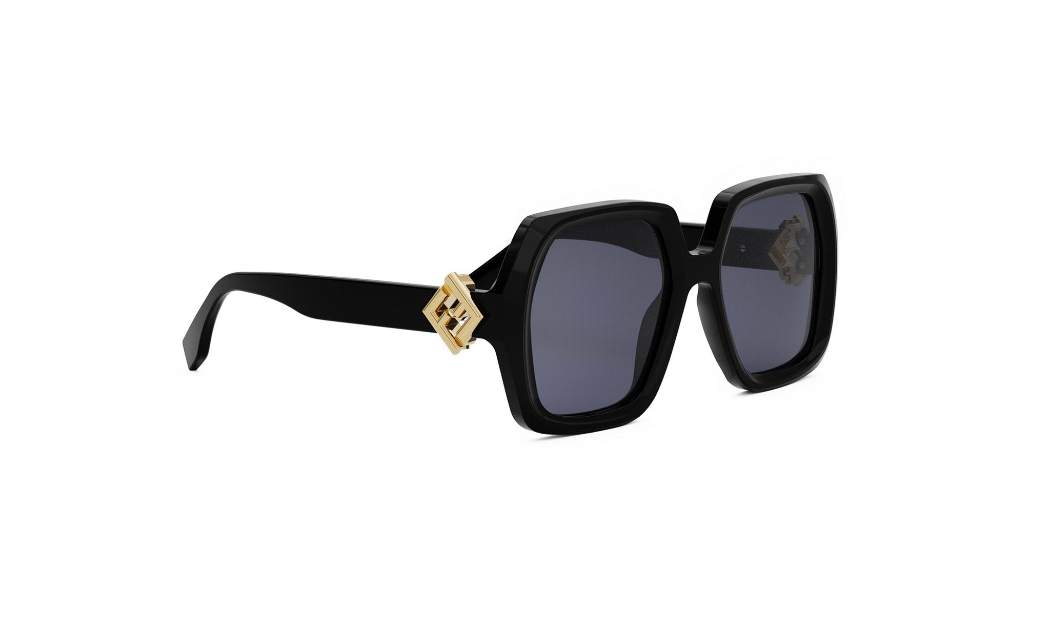 A pair of black sunglasses with a gold-colored frame and a distinctive logo on the side.