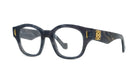 A pair of stylish, black-framed glasses with gold accents, featuring a distinctive logo on the side.
