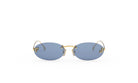 A pair of oval-shaped sunglasses with gold-colored frames and dark blue lenses.