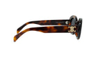 A pair of sunglasses with a tortoiseshell frame and a gold C logo on the side.
