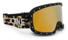A pair of stylish ski goggles with a leopard print strap and gold-colored lenses.