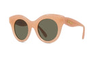 A pair of peach-colored sunglasses with dark green lenses.
