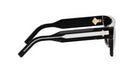 A pair of black and white sunglasses with a gold-colored frame.