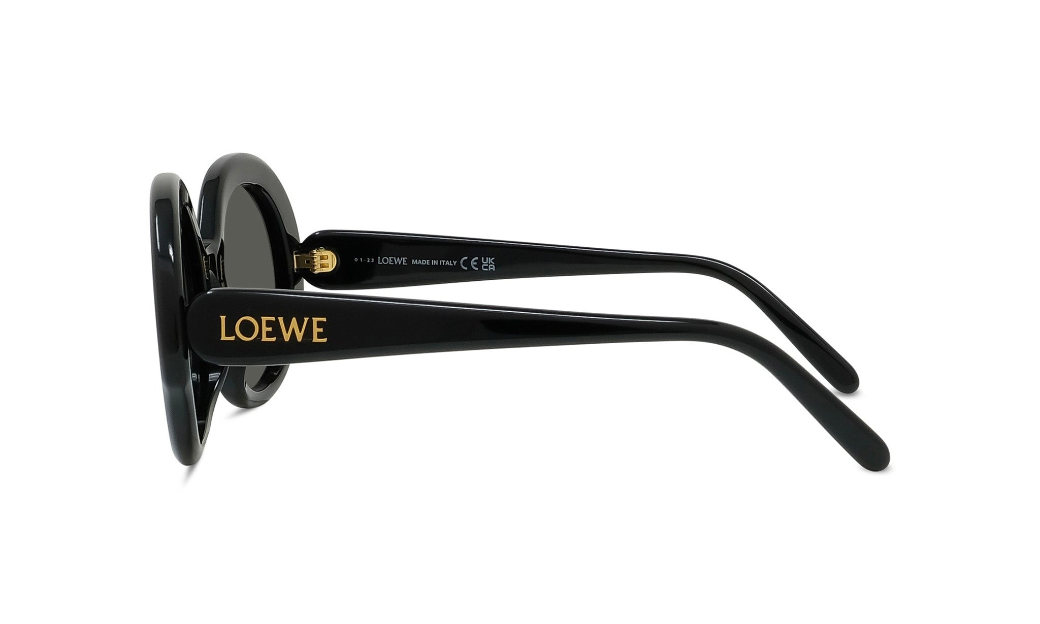 A pair of black sunglasses with gold text on the frame.