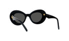 A pair of black, round sunglasses with gold accents.