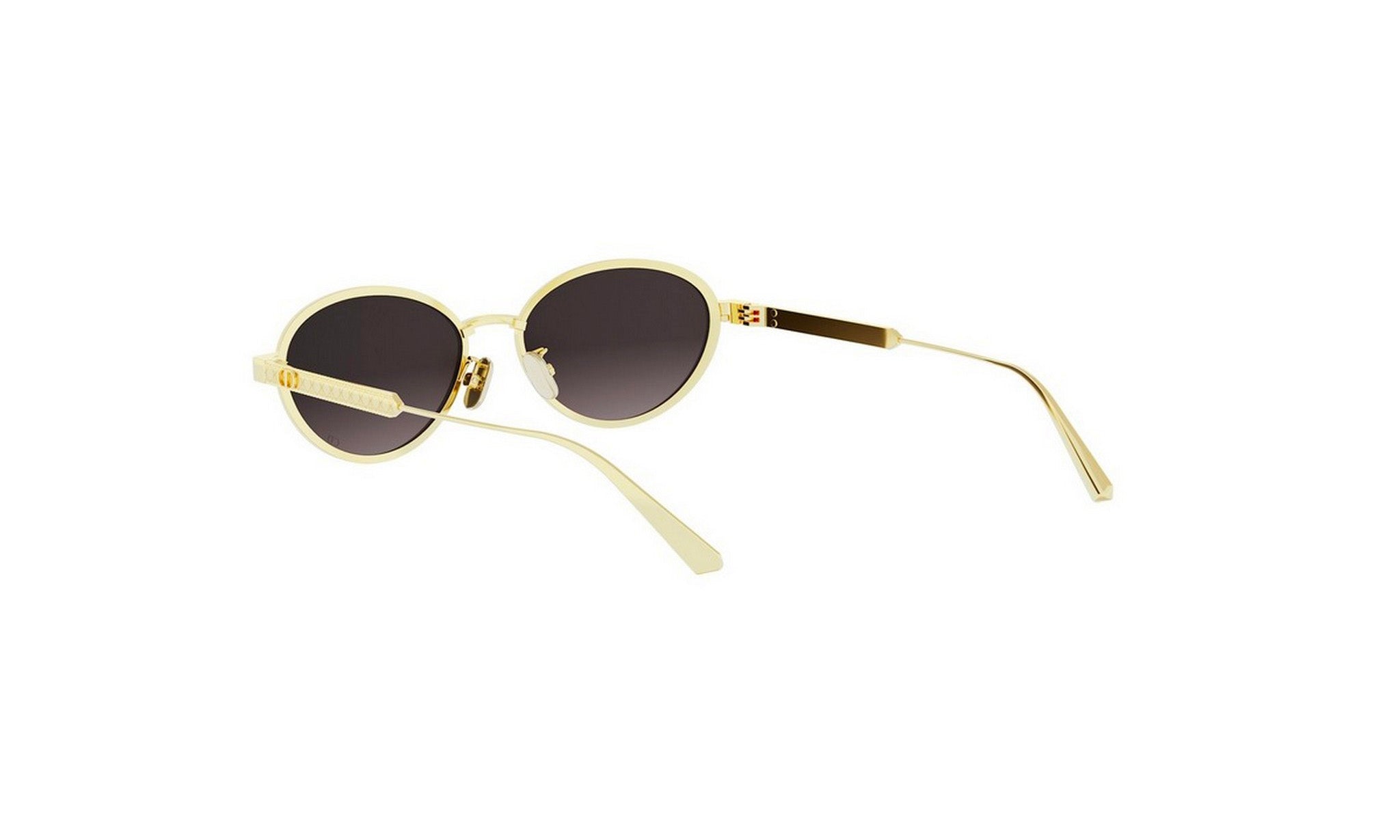 A pair of gold-colored sunglasses with dark lenses.