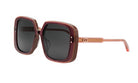 A pair of stylish sunglasses with dark lenses and a pink frame.