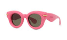 A pair of pink sunglasses with dark lenses.