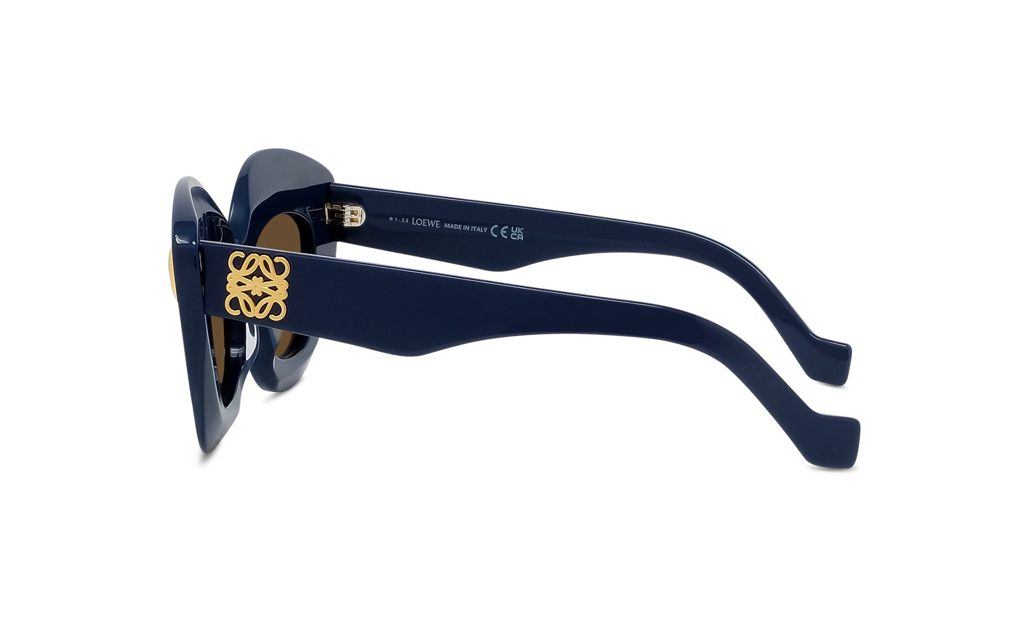 A pair of blue sunglasses with a gold logo on the frame.