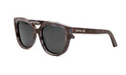 A pair of brown cat-eye sunglasses with the brand name "Christian Dior" printed on the frame.