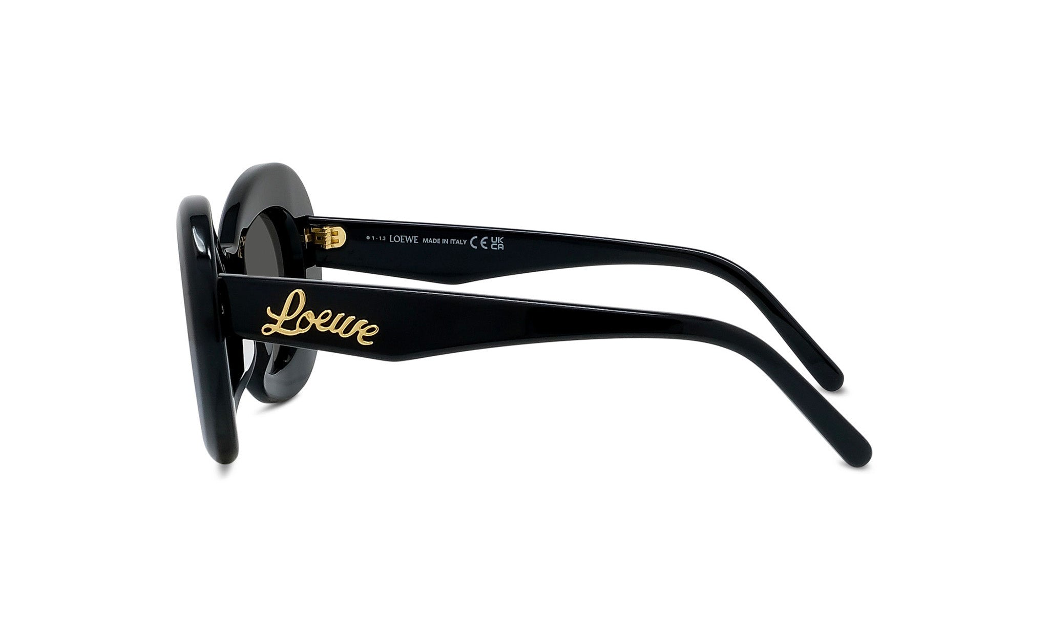 A pair of black sunglasses with gold text on the frame.