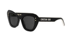 A pair of black cat-eye sunglasses with gold star embellishments and the brand name "Christian Dior" printed on the frame.