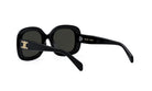 A pair of black sunglasses with a gold logo on the frame.