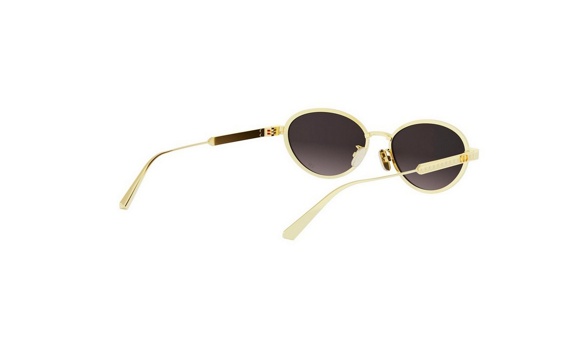 A pair of gold-colored sunglasses with dark lenses.