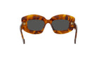 A pair of stylish sunglasses with a tortoiseshell frame and dark lenses.